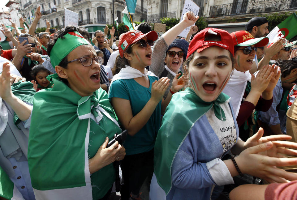 Algerian protesters gather during an anti-government demonstration in the centre of the capital Algiers, Algeria, Friday, June 7, 2019. Banner in French reads "Not a monarchy, not a dictatorship. We are one Algeria." (AP Photo/Anis Belghoul)