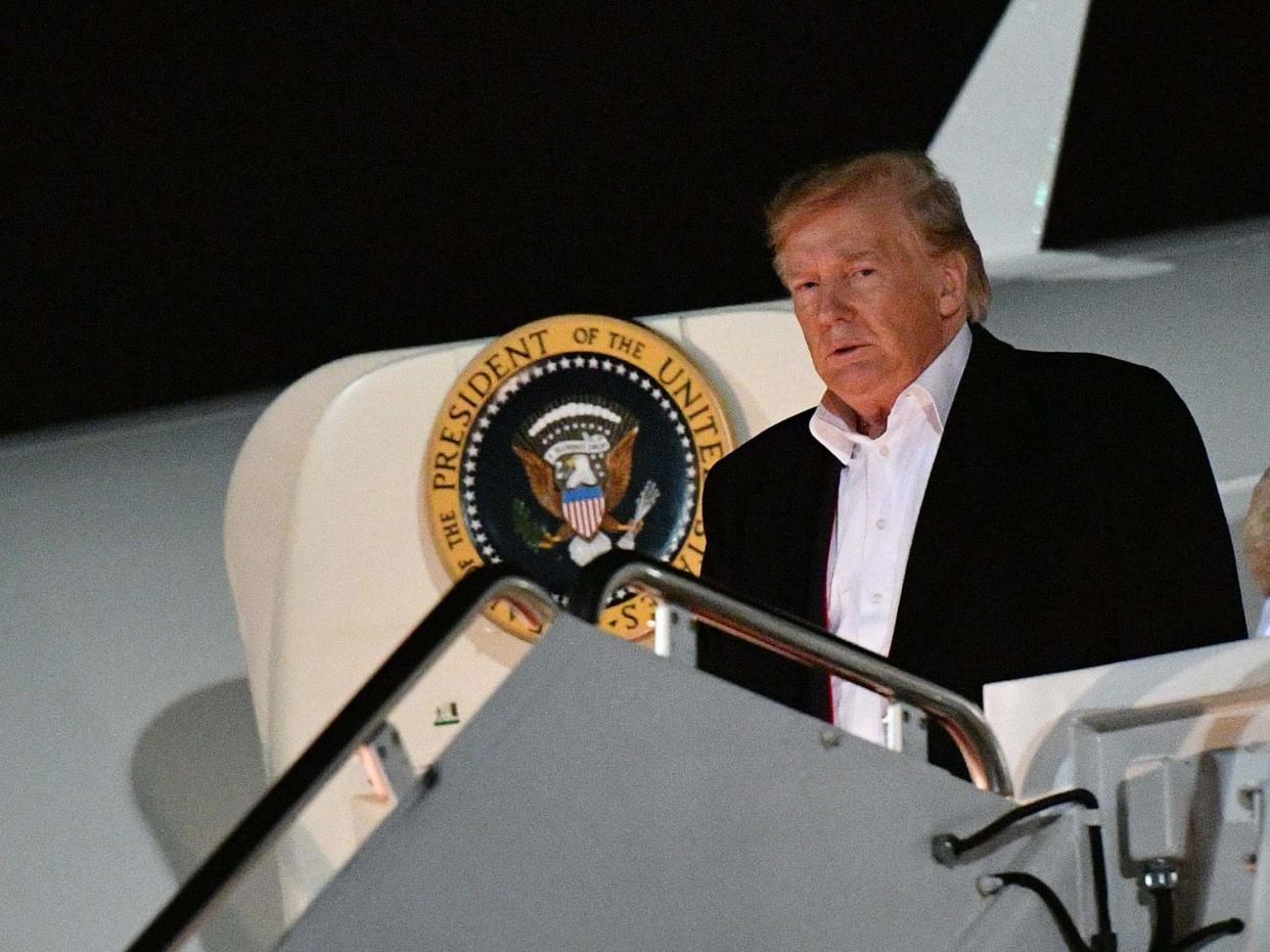 Donald Trump steps off Air Force One, hours before launching his fresh tirade against 'fake news': AFP/Getty