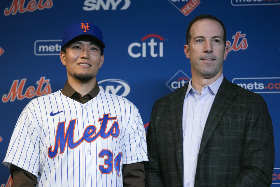 New York Mets Kodai Senga, left, and general manager Billy Eppler poses for a picture during a news conference at Citi Field, Monday, Dec. 19, 2022, in New York. The Japanese pitcher and the New York Mets baseball team have finalized a $75 million, five-year contract. (AP Photo/Seth Wenig)
