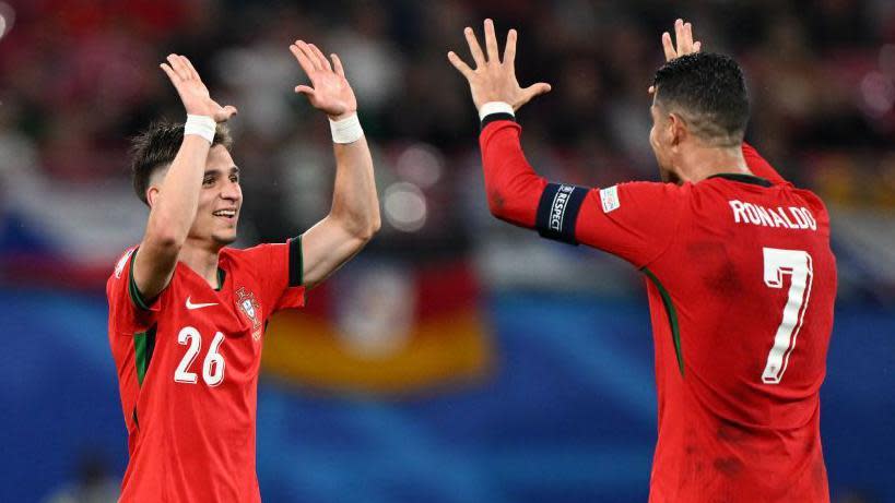 Cristiano Ronaldo celebrates with Francisco Conceição after the youngster's victory against the Czech Republic