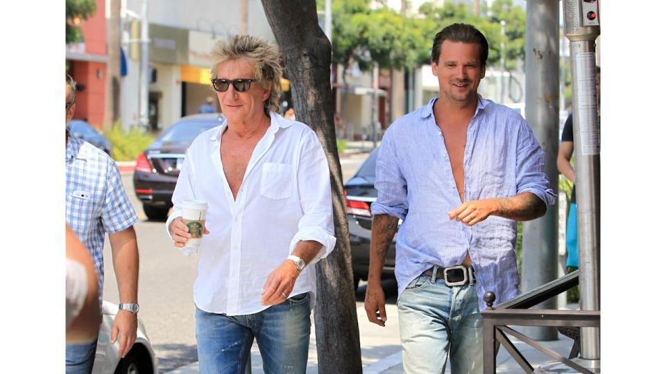 Rod Stewart and Sean Stewart walking in mostly open shirts