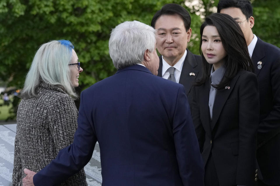 South Korea's President Yoon Suk Yeol and his wife Kim Keon Hee talk with Judy Wade, the niece of Medal of Honor recipient Cpl. Luther Story, and her husband Joseph Wade, as they visit the Korean War Veterans Memorial in Washington, Tuesday, April 25, 2023. (AP Photo/Susan Walsh)