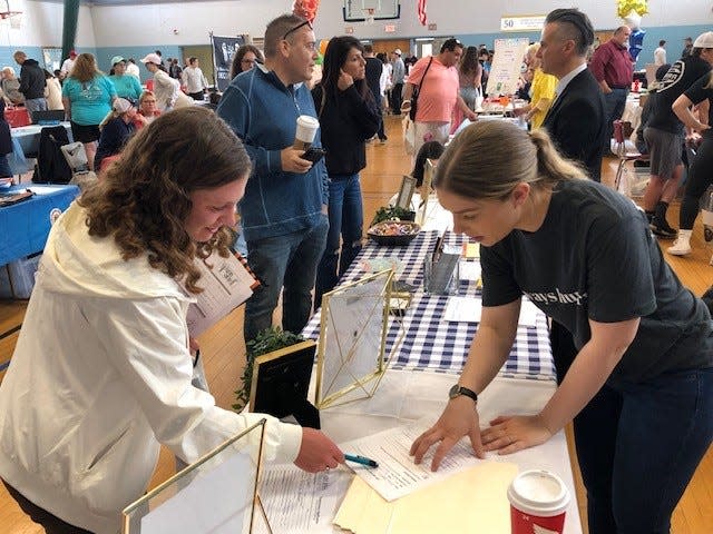 Allison Haworth, 18, Lumberton, (left) discusses job opportunities with Helen McIntyre, director of human resources for Fearless Restaurants, which own Daddy O Restaurant and Hotel and Tuckers Tavern on Long Beach Island.