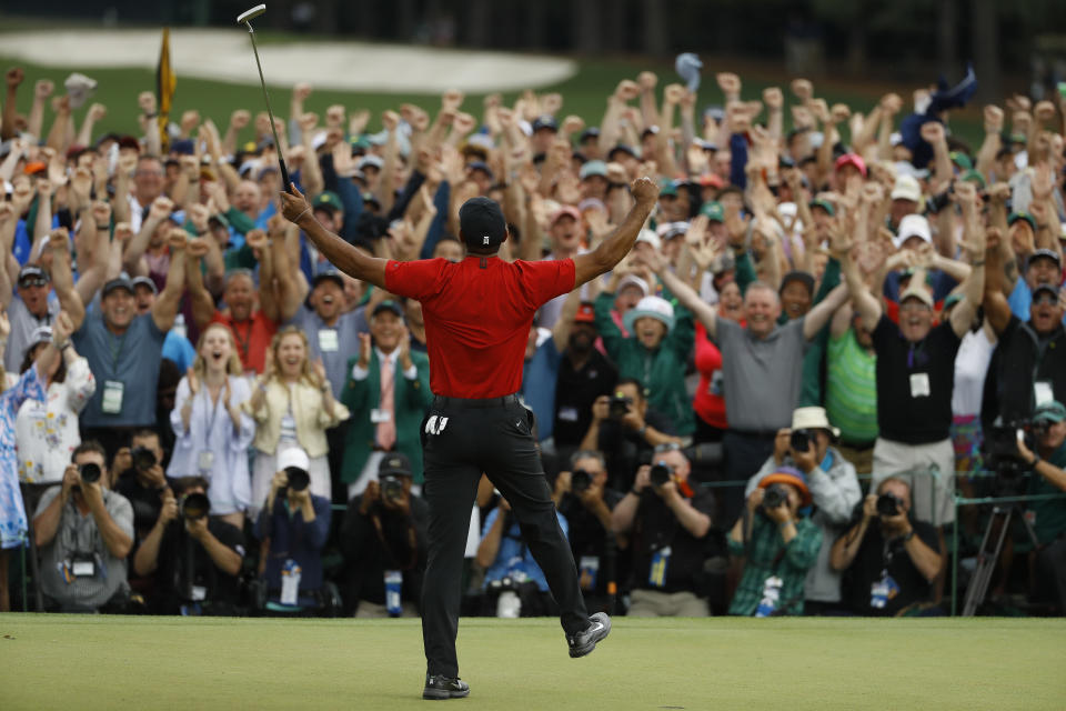 Eighteenth-green celebrations are great whether there are 10,000 people in attendance or zero. (AP)