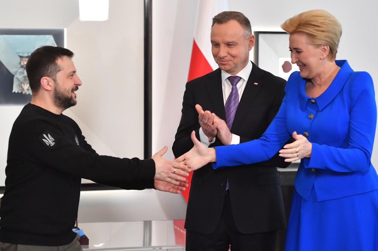 Polish President Andrzej Duda (2R) with his wife Agata Kornhauser-Duda (R) and Ukrainian President Volodymyr Zelensky (L) during a meeting at the Presidential Palace in Warsaw (EPA)
