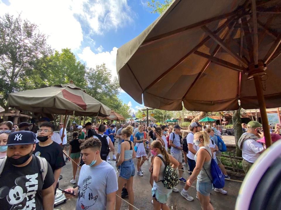 People wait in line for the Seven Dwarfs Mine Train minutes after Magic Kingdom opened.