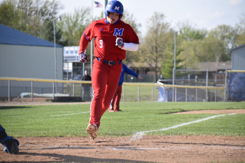 Martinsville's Riddick Bolton scores a run during the Artesians' Mid-State matchup with Whiteland on April 26, 2022.
