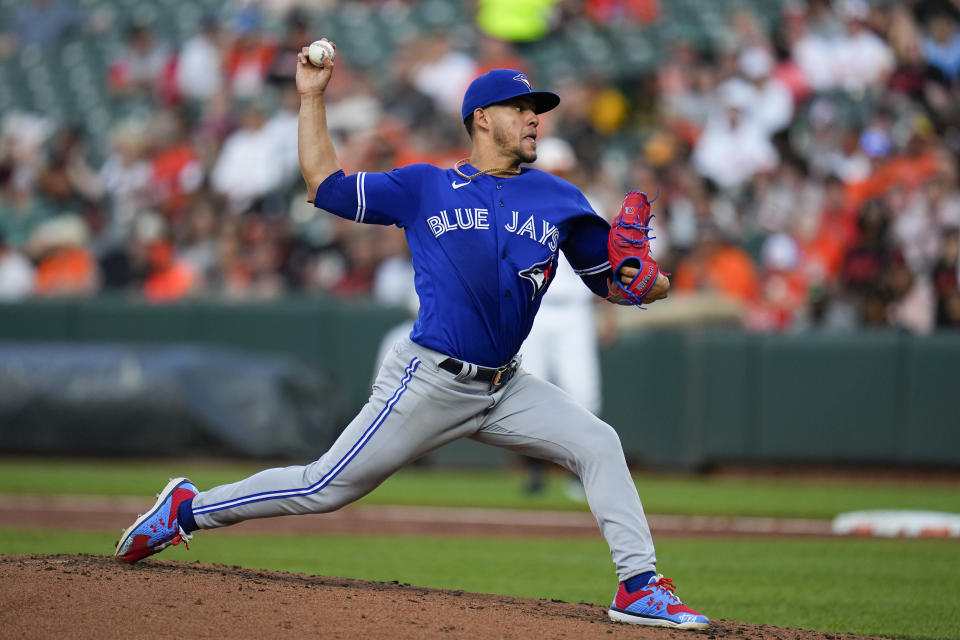 Toronto Blue Jays starting pitcher Jose Berrios throws a pitch to the Baltimore Orioles during the second inning of a baseball game, Wednesday, June 14, 2023, in Baltimore. (AP Photo/Julio Cortez)