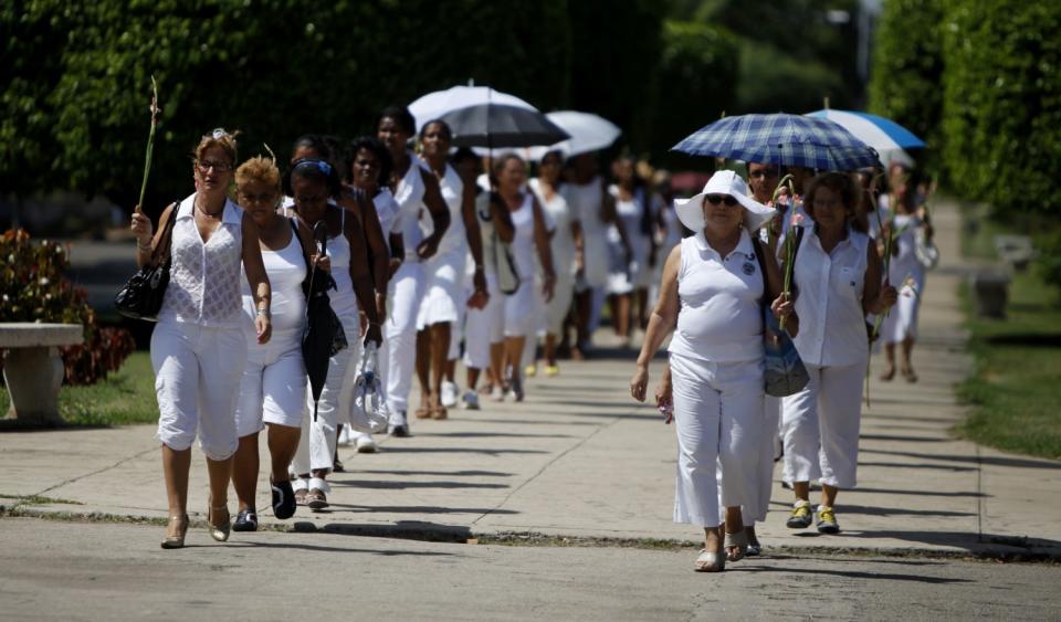 Members of the Cuban female dissident group Ladies in White demonstrate during their weekly march in Havana in 2010.