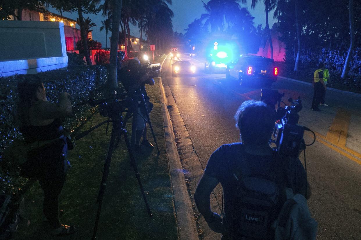 Media stand outside Mar-A-Lago in Palm Beach, Fla., on Monday, August 8, 2022. 