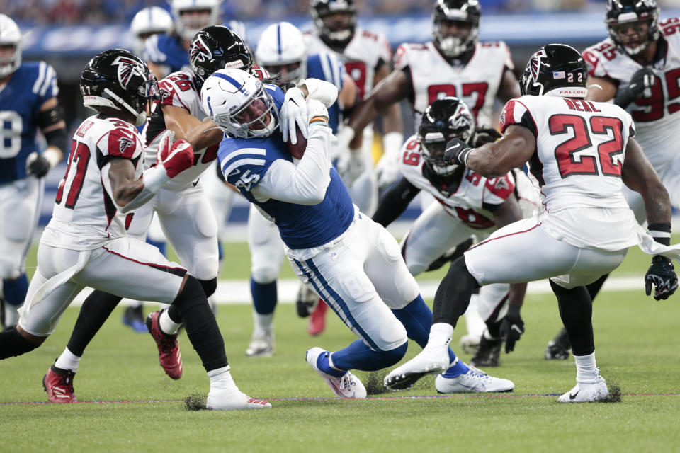 Indianapolis Colts tight end Eric Ebron (85) is tackled by Atlanta Falcons free safety Ricardo Allen (37) and strong safety Keanu Neal (22) during the first half of an NFL football game, Sunday, Sept. 22, 2019, in Indianapolis. (AP Photo/AJ Mast)