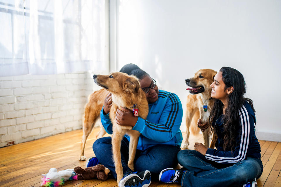 Mattie and Kira with their dogs (Courtesy of Kristen Kidd Photography)