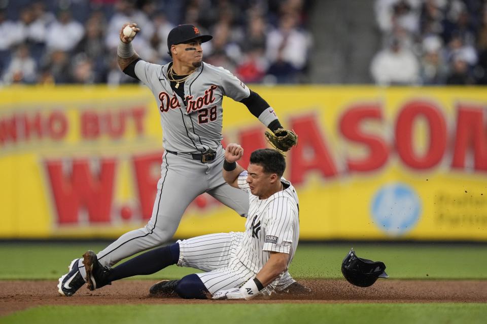 Detroit Tigers' Javier Báez (28) throws out New York Yankees' Juan Soto at first base after forcing out Anthony Volpe for a double play during the first inning of a baseball game, Friday, May 3, 2024, in New York. (AP Photo/Frank Franklin II)