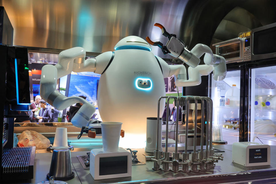 ADAM makes drinks for attendees at the Richtech Robotics booth at CES in Las Vegas on Jan. 10, 2024. (Ethan Miller / Getty Images)