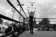 <p>Female police officers served as round card girls, strutting around the ring for the Brooklyn Smoker in the parking lot of Gargiulo’s Italian restaurant in Coney Island, Brooklyn, on Aug. 24, 2017. (Photo: Gordon Donovan/Yahoo News) </p>