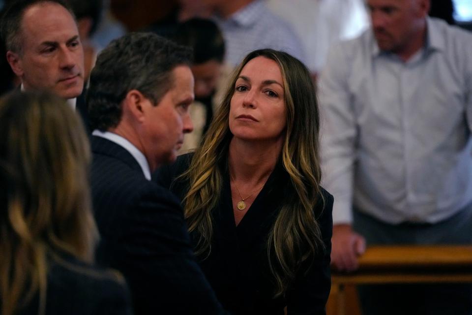 Karen Read stands as jurors depart the court for the weekend at the trial of Read at Norfolk Superior Court, Friday, June 28, 2024, in Dedham, Mass. Read, 44, is accused of running into her Boston police officer boyfriend with her SUV in the middle of a nor'easter and leaving him for dead after a night of heavy drinking. (AP Photo/Charles Krupa, Pool)