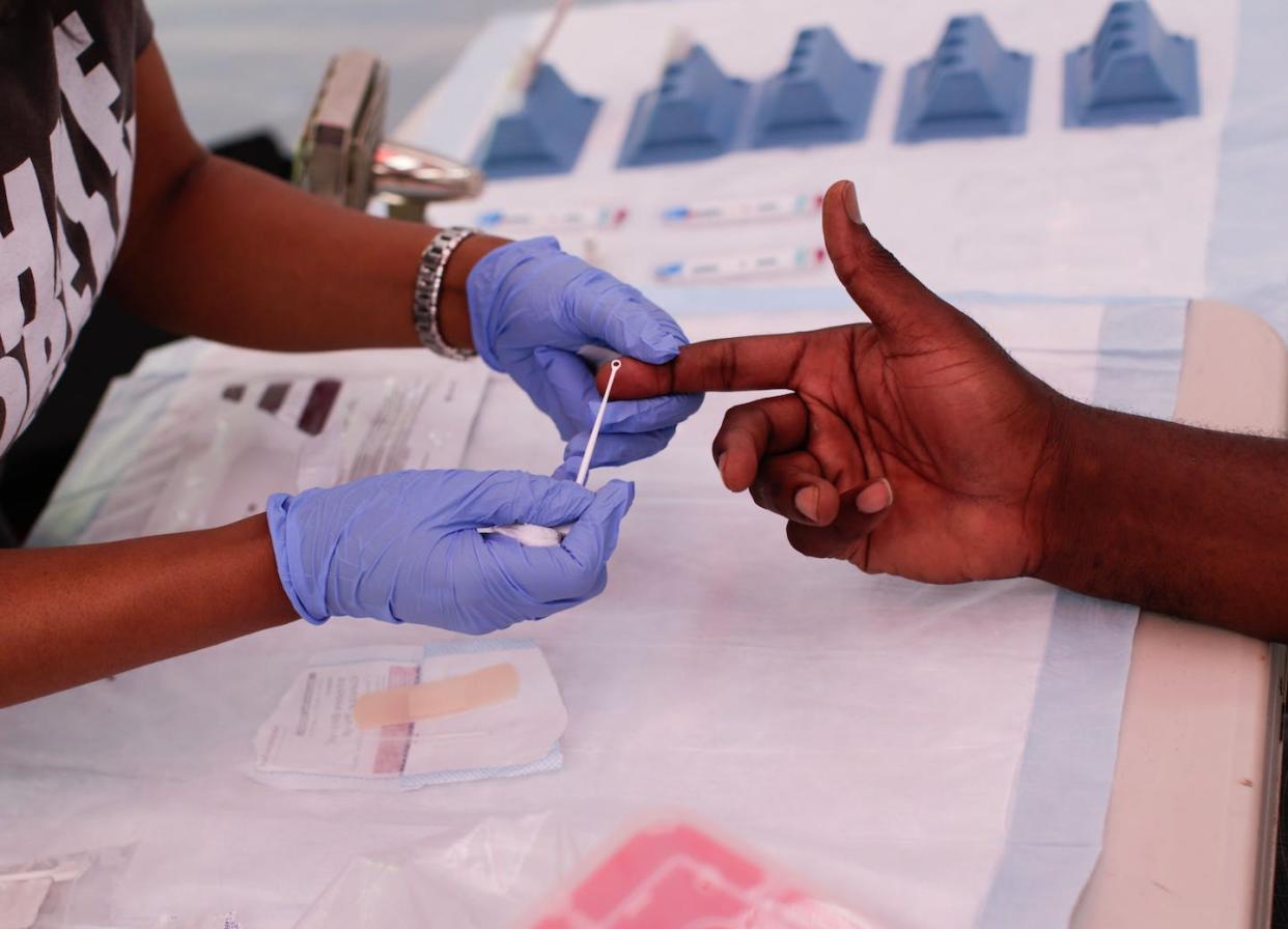 A man takes a free HIV test during the Harlem Pride parade in New York City. <a href="https://www.gettyimages.com/detail/news-photo/man-takes-a-free-hiv-test-during-the-harlem-pride-parade-in-news-photo/1152819582?adppopup=true" rel="nofollow noopener" target="_blank" data-ylk="slk:Kena Betancur/AFP via Getty Images);elm:context_link;itc:0;sec:content-canvas" class="link ">Kena Betancur/AFP via Getty Images)</a>