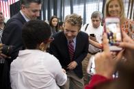 Sen. Rand Paul, R-Ky., greets Angelika Noel, 17, during a visit to Josephinum Academy in Chicago to participate in a discussion on school choice on Tuesday, April 22, 2014. (AP Photo/Andrew A. Nelles)