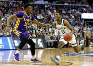 Mar 29, 2019; Washington, DC, USA; Michigan State Spartans forward Aaron Henry (11) drives to the basket against LSU Tigers forward Kavell Bigby-Williams (11) during the first half in the semifinals of the east regional of the 2019 NCAA Tournament at Capital One Arena. Mandatory Credit: Amber Searls-USA TODAY Sports