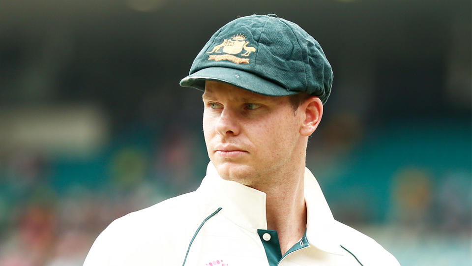 Australia's premier batsman Steve Smith looking at the pitch while fielding.