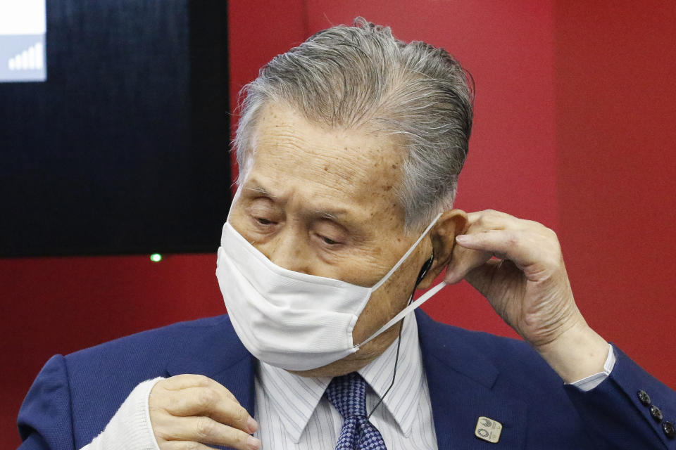 President of Tokyo 2020 Yoshiro Mori wears a face mask before he leaves a joint press conference between the International Olympic Committee (IOC) and Tokyo Organizing Committee of the Olympic and Paralympic Games (Tokyo 2020) Friday, Sept. 25, 2020, in Tokyo. (Rodrigo Reyes Marin/Pool Photo via AP)