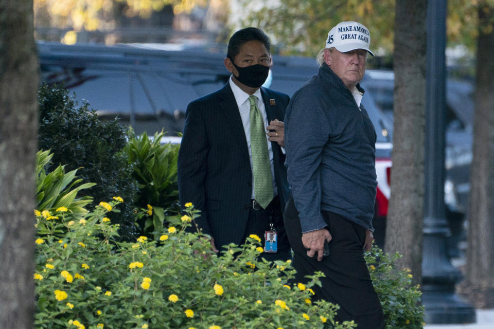 President Donald Trump returns to the White House after playing a round of golf, Saturday, Nov. 7, 2020, in Washington. (AP Photo/Evan Vucci)