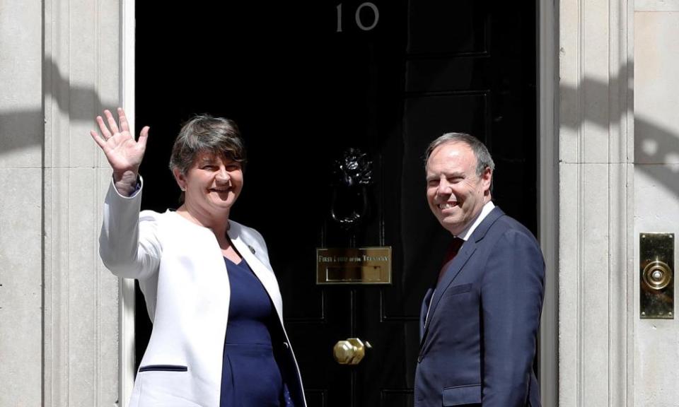 The leader of the Democratic Unionist party, Arlene Foster, and the deputy leader, Nigel Dodds, on the steps of 10 Downing Street