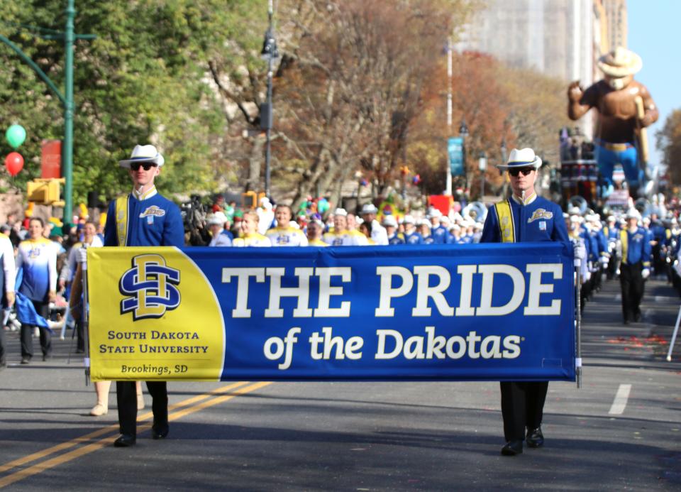 The Pride of the Dakotas marches in Macy’s Thanksgiving Day Parade.