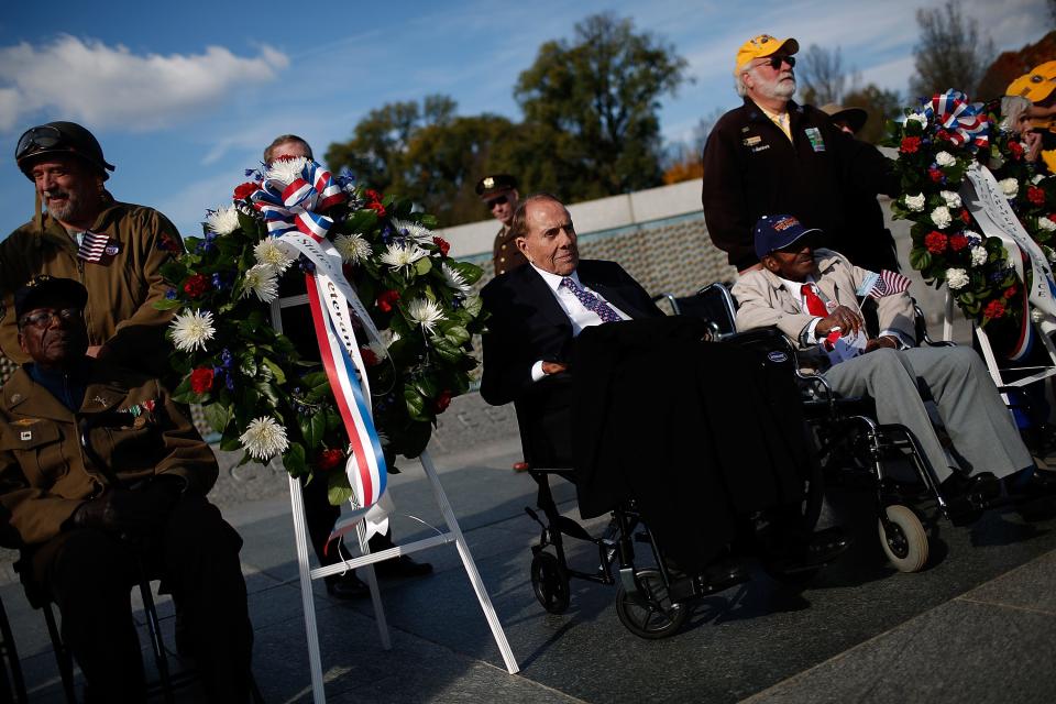 Former Sen. Bob Dole, wearing a blue tie, at the World War II Memorial in 2016.