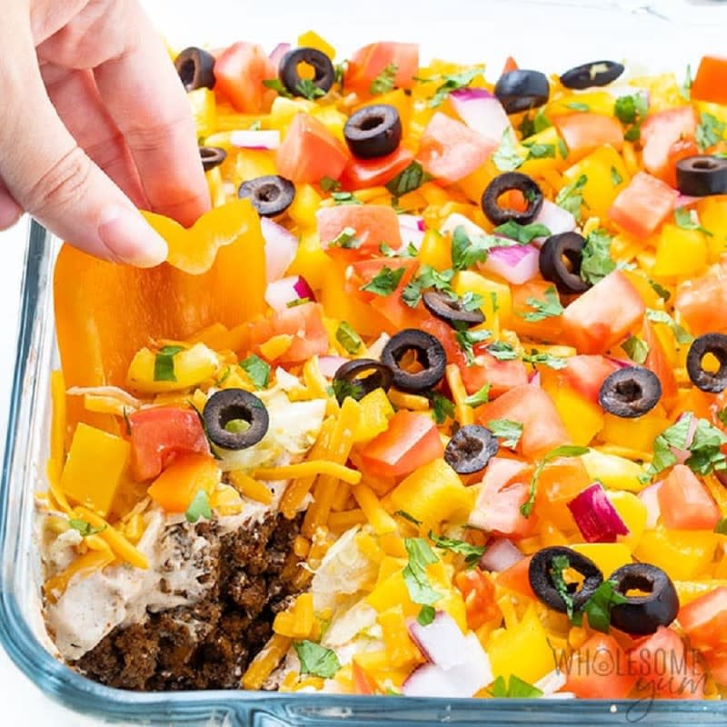 <p>Wholesome Yum</p><p>It's a keto taco dip served with bell pepper scoops.</p><p><strong>Get the recipe: </strong><a href="https://www.wholesomeyum.com/keto-7-layer-taco-dip-recipe/" rel="nofollow noopener" target="_blank" data-ylk="slk:7-Layer Taco Dip Recipe;elm:context_link;itc:0;sec:content-canvas" class="link rapid-noclick-resp"><strong>7-Layer Taco Dip Recipe</strong></a></p>