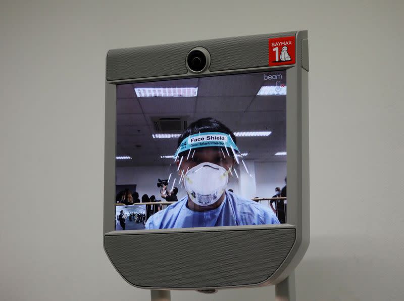 A "telepresence" robot which provides face-to-face medical consultation is pictured at Changi Exhibition Centre which has been repurposed into a community isolation facility, in Singapore