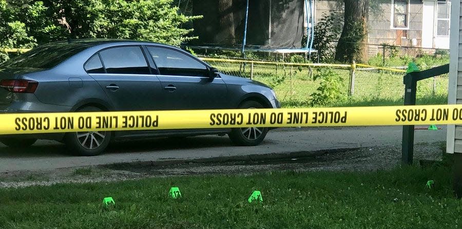 Cones of the type police use to mark evidence could be seen Tuesday morning at the scene where Louis Perez Cantrell had been fatally shot.