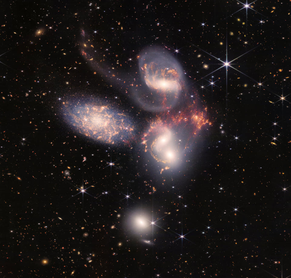 A group of five galaxies that appear close to each other in the sky: two in the middle, one toward the top, one to the upper left, and one toward the bottom.<span class="copyright">NASA, ESA, CSA, STScI</span>