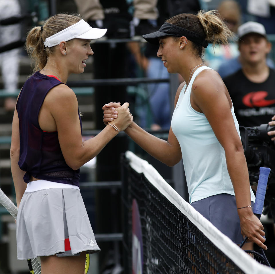 Madison Keys, at right, shakes hands with Caroline Wozniacki, from Denmark, after Keys won 7-6(5), 6-3, to win their finals match at the Volvo Car Open in Charleston, S.C., Sunday, April 7, 2019. (AP Photo/Mic Smith)