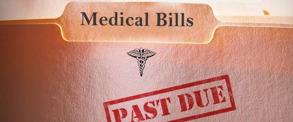 File folders with Past Due Medical Bills text