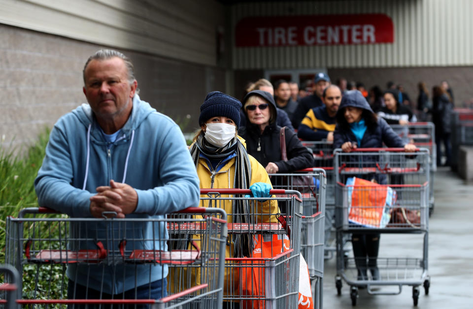 NOVATO, CALIFORNIA - MARCH 14: Hundreds of customers wait in line to enter a Costco store on March 14, 2020 in Novato, California. Some Americans are stocking up on food, toilet paper, water and other items after the World Health Organization (WHO) declared Coronavirus (COVID-19) a pandemic. (Photo by Justin Sullivan/Getty Images)