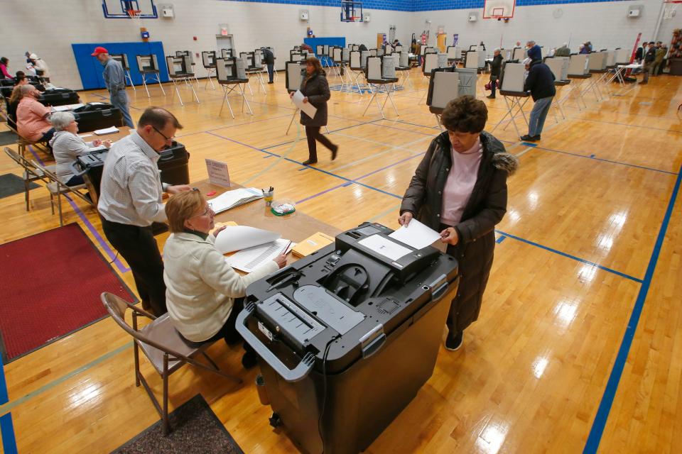 A woman votes in the Super Tuesday presidential primary election at the Fairhaven Recreational Center polling station on March 5, 2024 in Fairhaven.