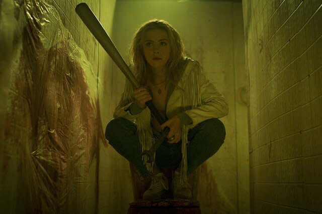 Kiernan Shipka as Jamie Hughes crouches with a baseball bat in Totally Killer (2023).