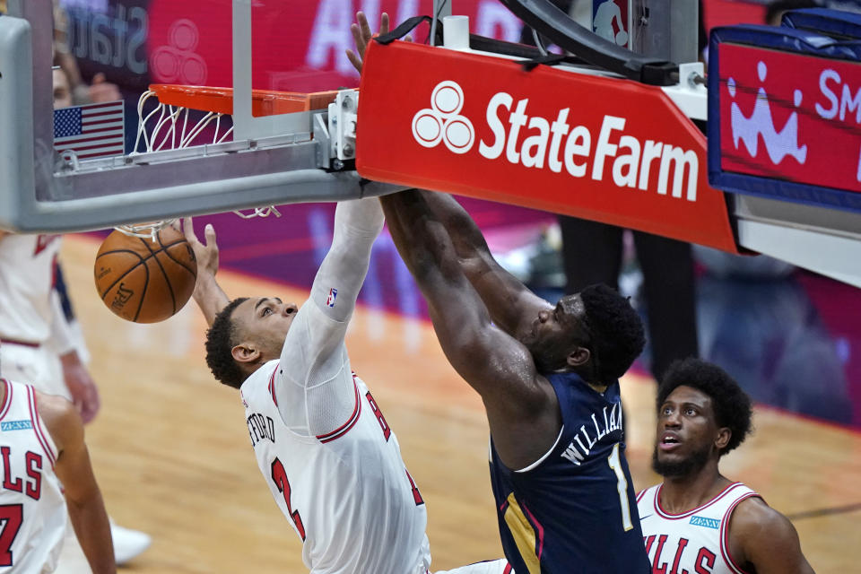 New Orleans Pelicans forward Zion Williamson (1) dunks against Chicago Bulls center Daniel Gafford during the first half of an NBA basketball game in New Orleans, Wednesday, March 3, 2021. (AP Photo/Gerald Herbert)