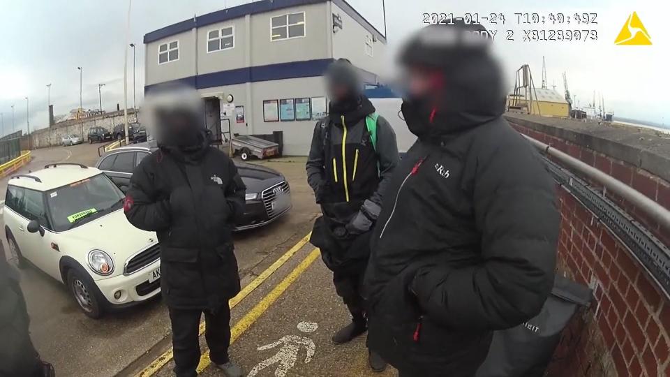 <p>A screengrab from body video of three men about to be fined for breaching covid regulations</p> (Kent Police/PA Wire)