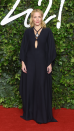 <p> Anderson looked stylish at the Fashion Awards 2021 in London. The actress wowed on the red carpet in a sweeping black gown by Chloe, which featured billowing long sleeves and cut-out detailing. She accessorised the look with wavy locks, dewy make-up and a statement necklace. </p>
