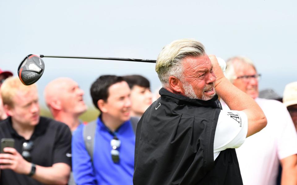 Darren Clarke was so distraught that he immediately walked straight off the course without speaking to the media - AFP