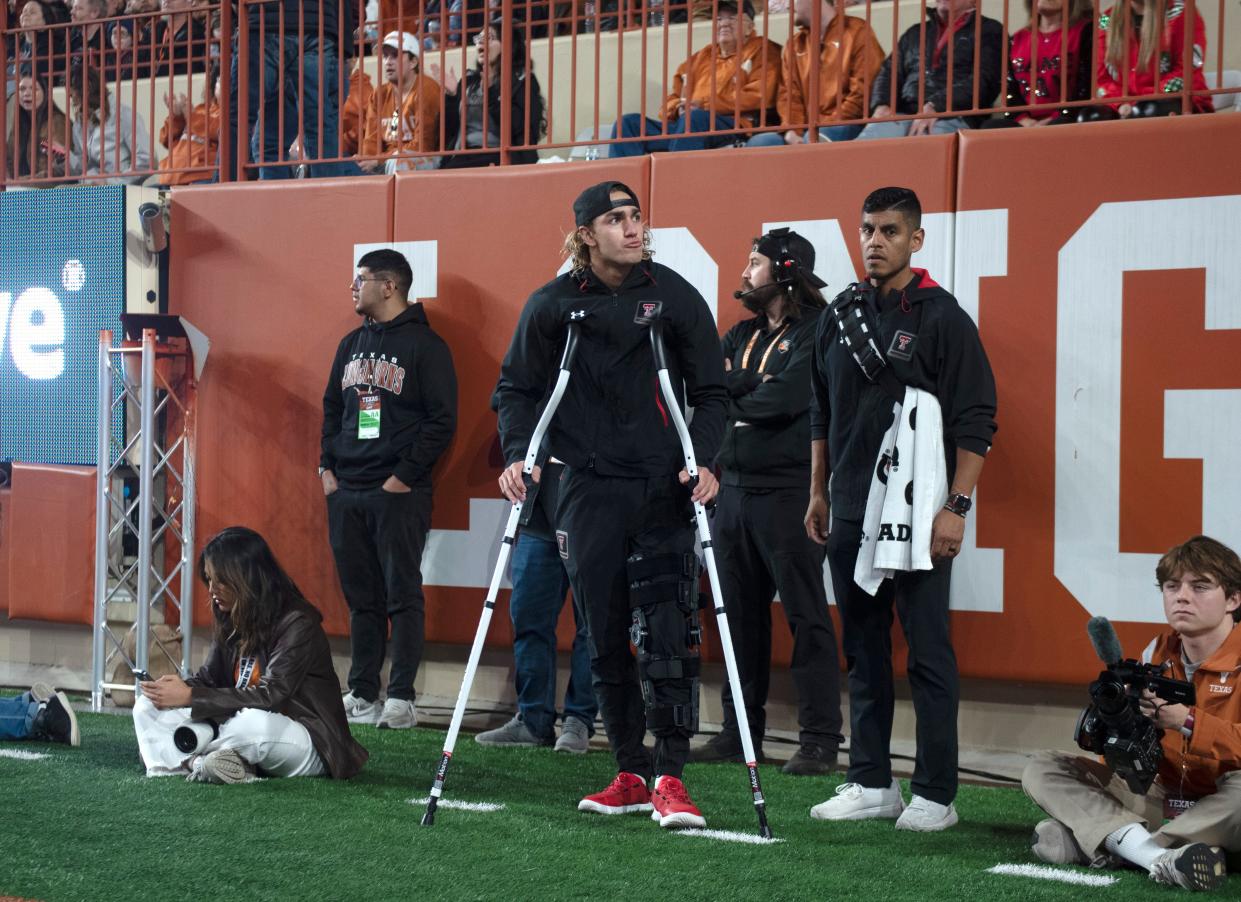 Texas Tech's long snapper Jackson Knotts (30) stands on the sidelines with crutches during the game against Texas Tech, Friday, Nov. 24, 2023, at Darrell K. Royal-Texas Memorial Stadium in Austin.