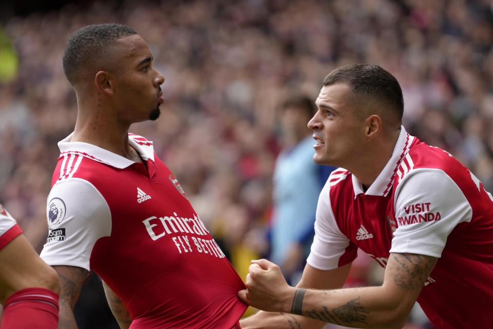 Arsenal's Gabriel Jesus, left, celebrates with Arsenal's Granit Xhaka after scoring his side's second goal during the English Premier League soccer match between Arsenal and Tottenham Hotspur, at Emirates Stadium, in London, England, Saturday, Oct. 1, 2022. (AP Photo/Kirsty Wigglesworth)