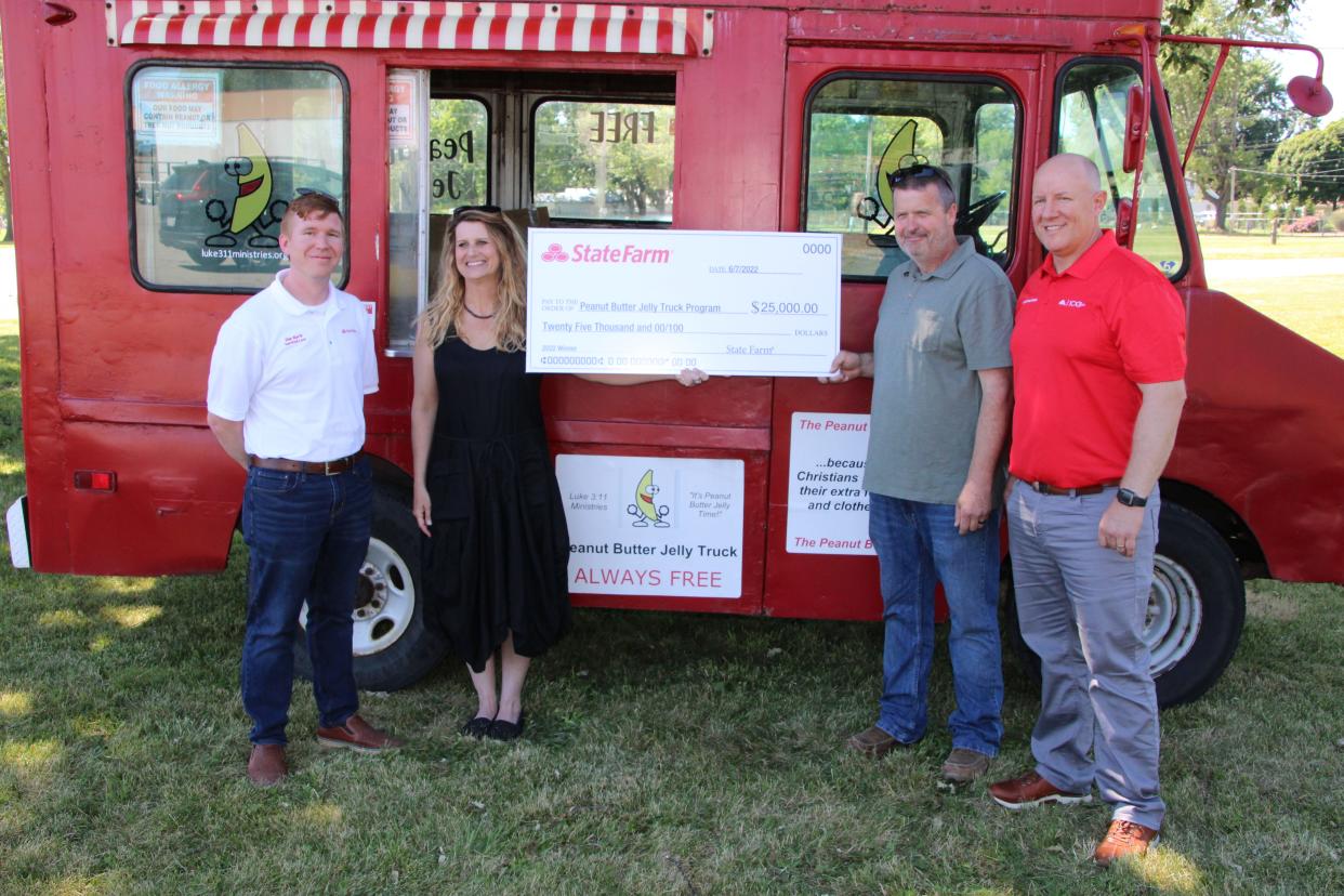 Luke 3:11 Ministries Peanut Butter Jelly Truck was awarded a $25,000 grant from the State Farm Insurance Neighborhood Assist Program. Luke 3:11 Ministries founders Amy and Brock Parker, center, accepted the check from Marion State Farm agents Dan Barth, left, and Nathan Hinesman, right, on Friday, June 24, 2022.