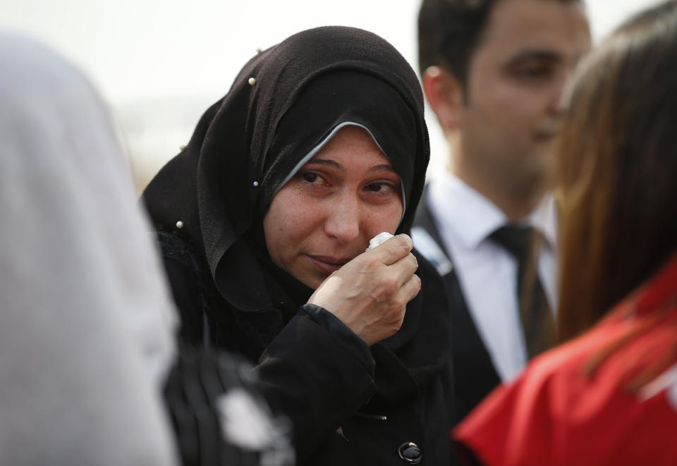 ADDS ID OF FAMILY MEMBER - Fatima, a refugee from Syria and the mother of 10-month-old Mohammed Omar Saar who was killed during incoming shelling from Syria the day before, cries during her son's funeral procession, Friday, Oct. 11, 2019, in Akcakale, Sanliurfa province, southeastern Turkey, along the border with Syria. (AP Photo/Lefteris Pitarakis)