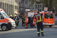 <p>Rescue workers stand outside the crime scene after a car crashed into a group of people leaving several dead in Muenster, Germany, Saturday, April 7, 2018. (Photo: Ferdinand Ostrop/AP) </p>