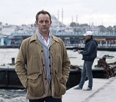 FILE - Former British army officer James Le Mesurier stands near the Golden Horn in this undated file photo, in Istanbul. The lifeless body of James Le Mesurier was found early Monday Nov. 11, 2019, in Istanbul, Turkey. Le Mesurier, a former British army officer who helped found the "White Helmets" volunteer organization in Syria, has been found dead in Istanbul, Turkish officials and news reports said Monday. (AP Photo/File)
