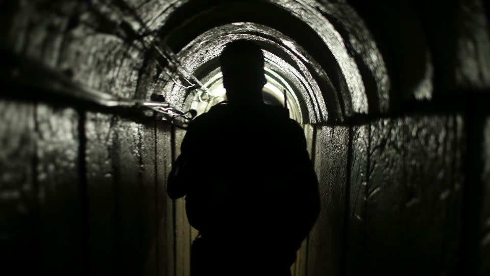 A Hamas fighter appears inside an underground tunnel in Gaza in 2014. - Mohammed Salem/Reuters/File