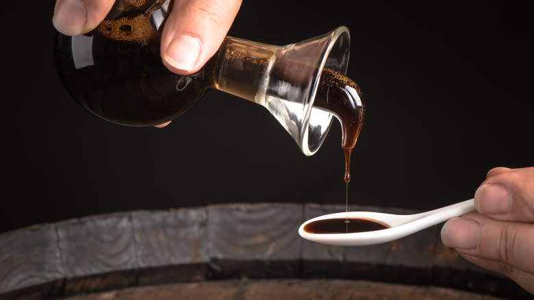 pouring balsamic vinegar into spoon